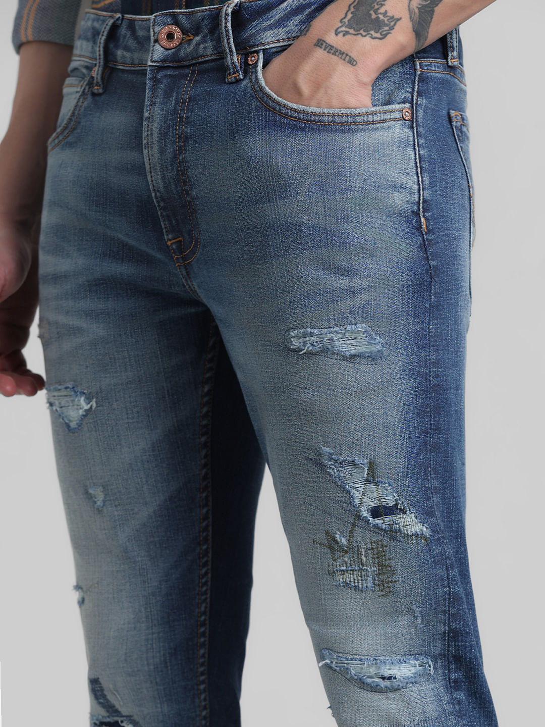 Distressed dark blue deals jeans