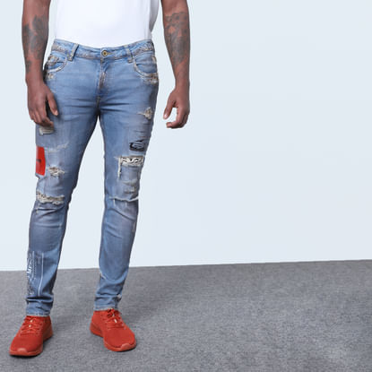 Blue Mid Rise Heavily Distressed Slim Jeans 