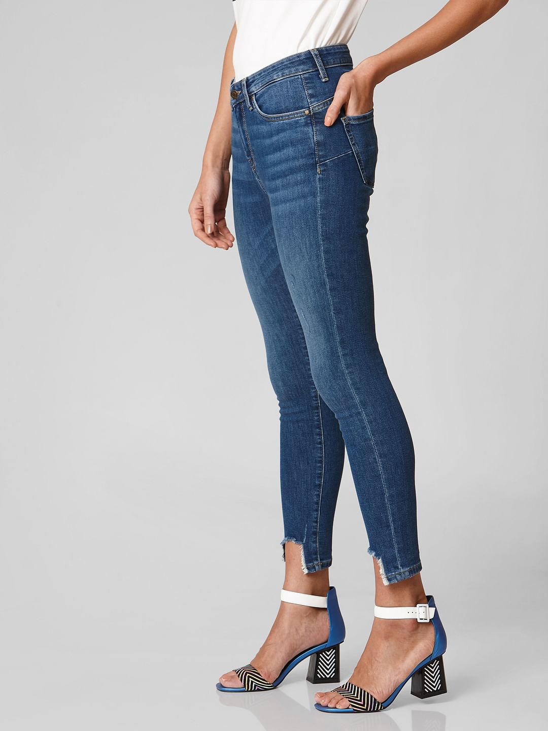 distressed hem skinny jeans