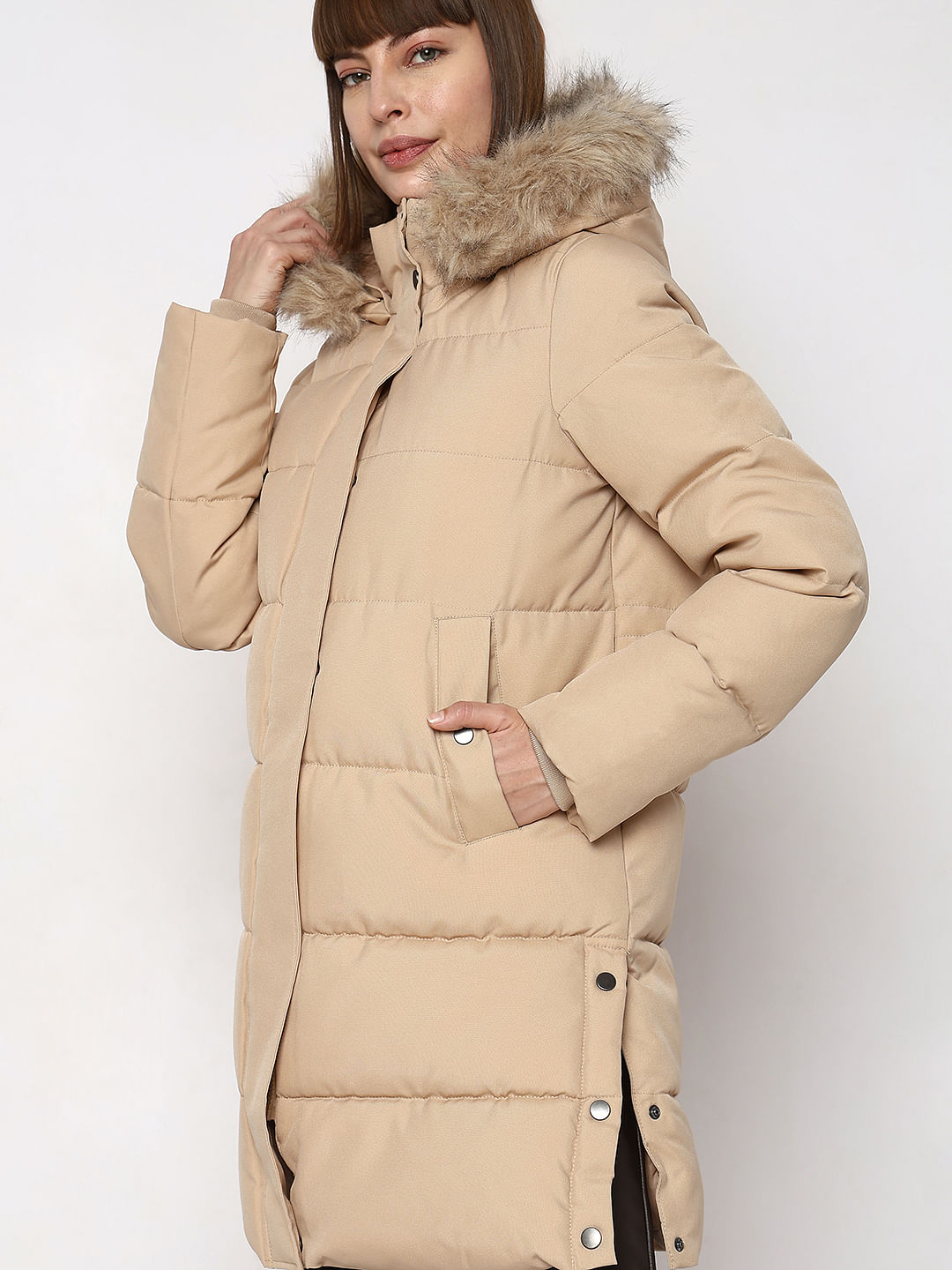 Beige puffer jacket with clearance fur hood